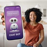 57170826_positive-young-black-woman-showing-phone-with-chat-bot.jpg